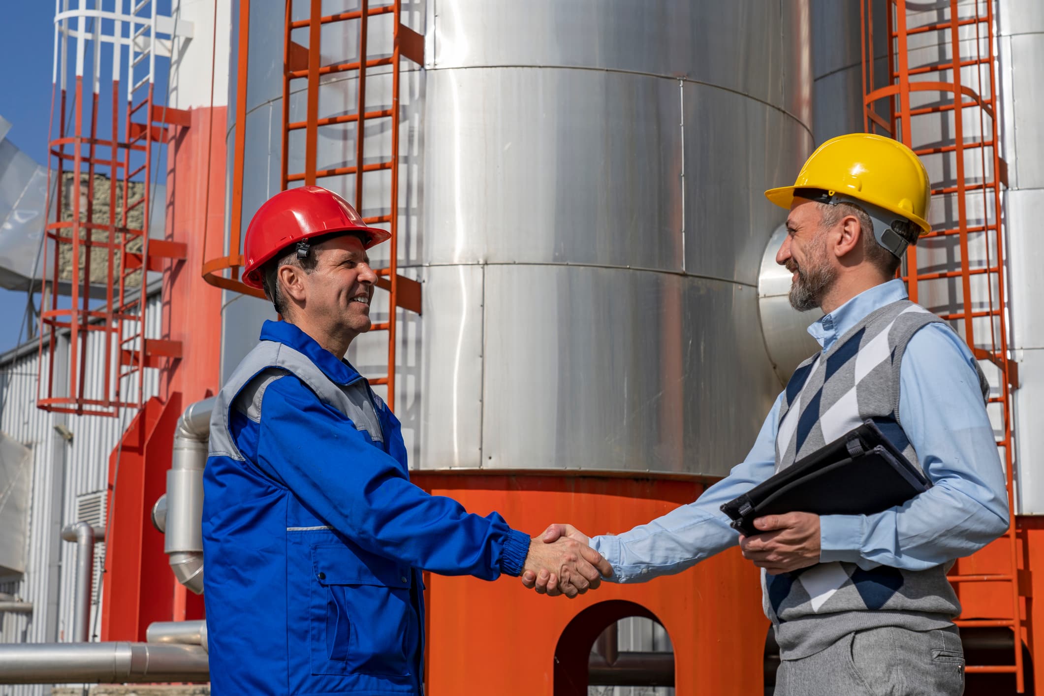 Worker in Personal Protective Equipment Meeting with Businessperson. Teamwork and Business Relationship Concept.